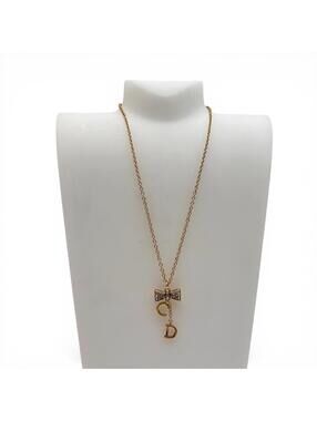 Christian Dior Gold Tone CD Bow Pendant Necklace